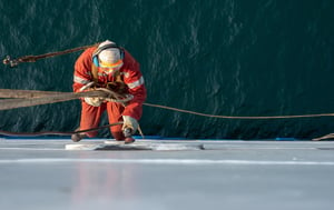 Man works on ship