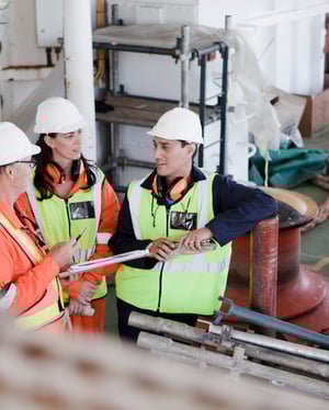 workers-discussing-on-a-ship-deck-2024-06-19-19-46-26-utc